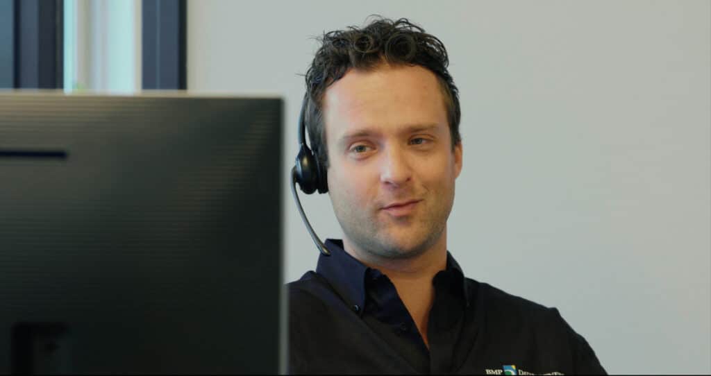 BMP Datapartners employee with headset on