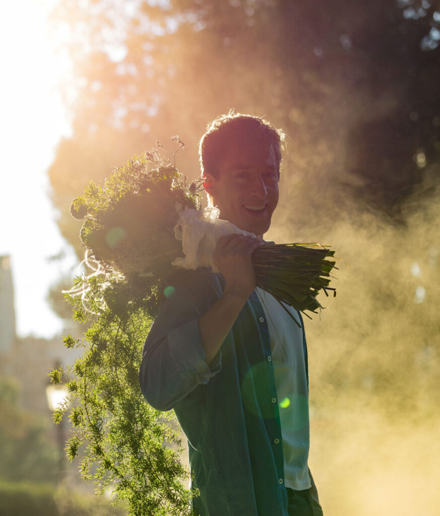 Cinefleur Robert holding bouquet over shoulder