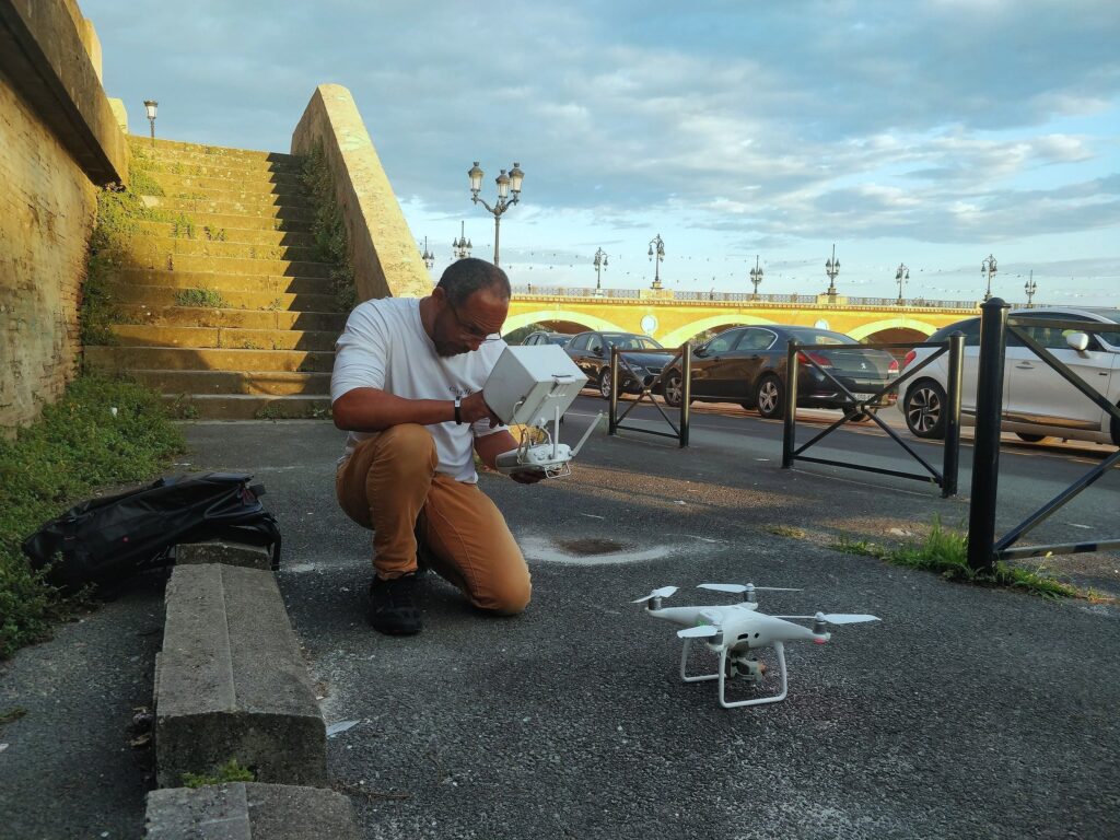 Chris crouched down with drone
