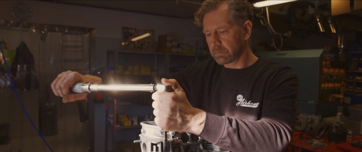 Man assembling engine of car