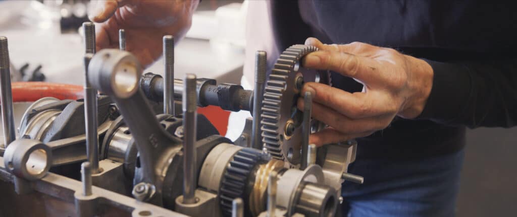 Man working on camshaft