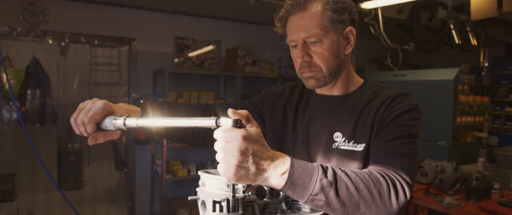 Man assembling engine of car