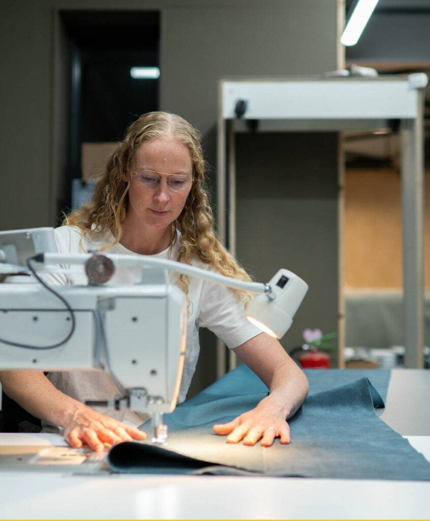 Woman using sewing machine