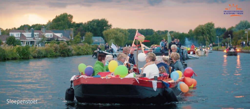 Parade of boats going through river