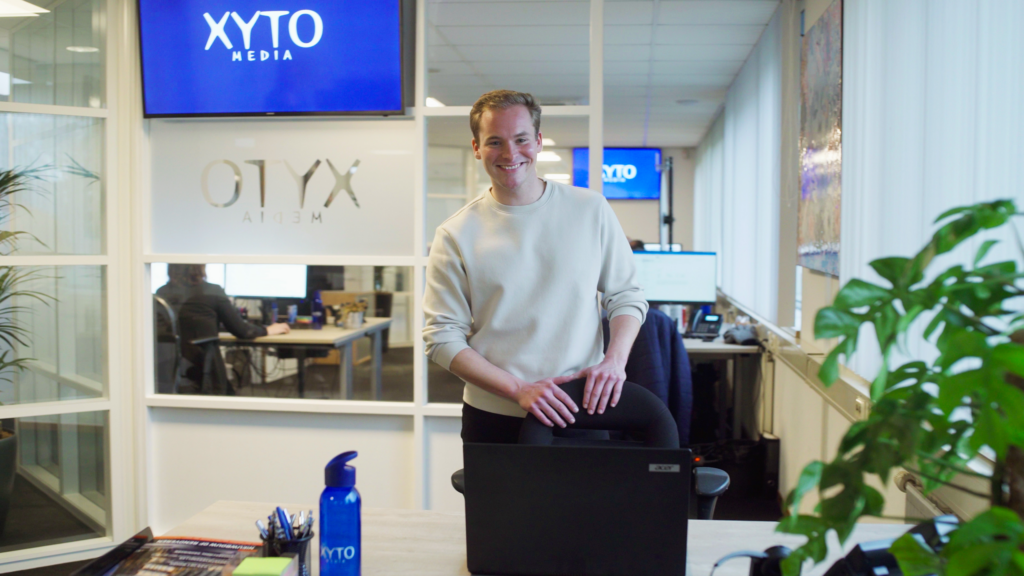 XYTO employee standing in office space