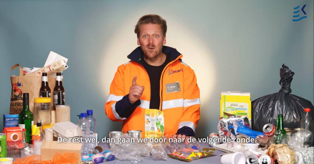 Man surrounded by trash talking about recycling